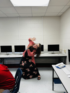 Photo of me in my classroom looking afraid of something above me.